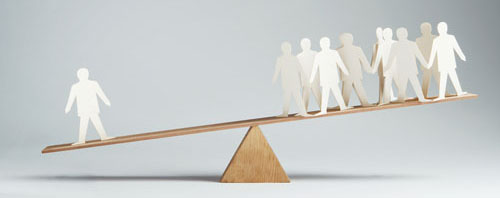 Men balanced on seesaw over a single man